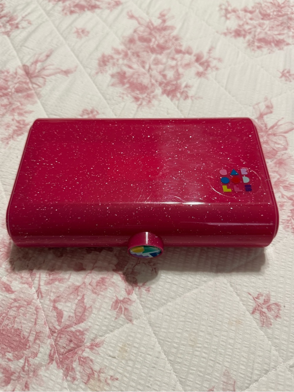 Caboodles On-The-Go Girl cosmetic case in a pink sparkle finish